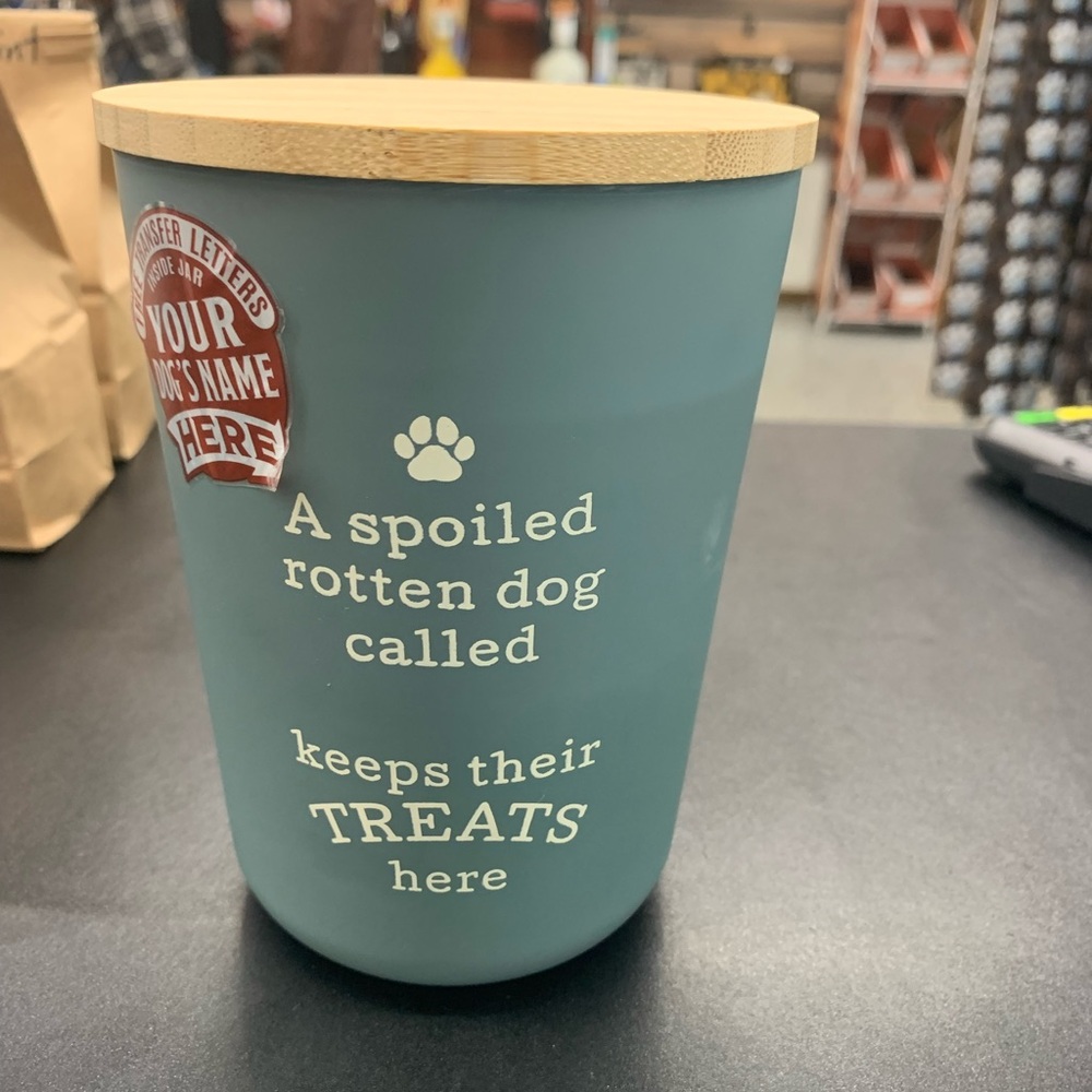 Plastic dog treat jar with wooden cap and customizable letters.